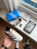 ADIZERO BOSTON 12 BRANCO LARANJA